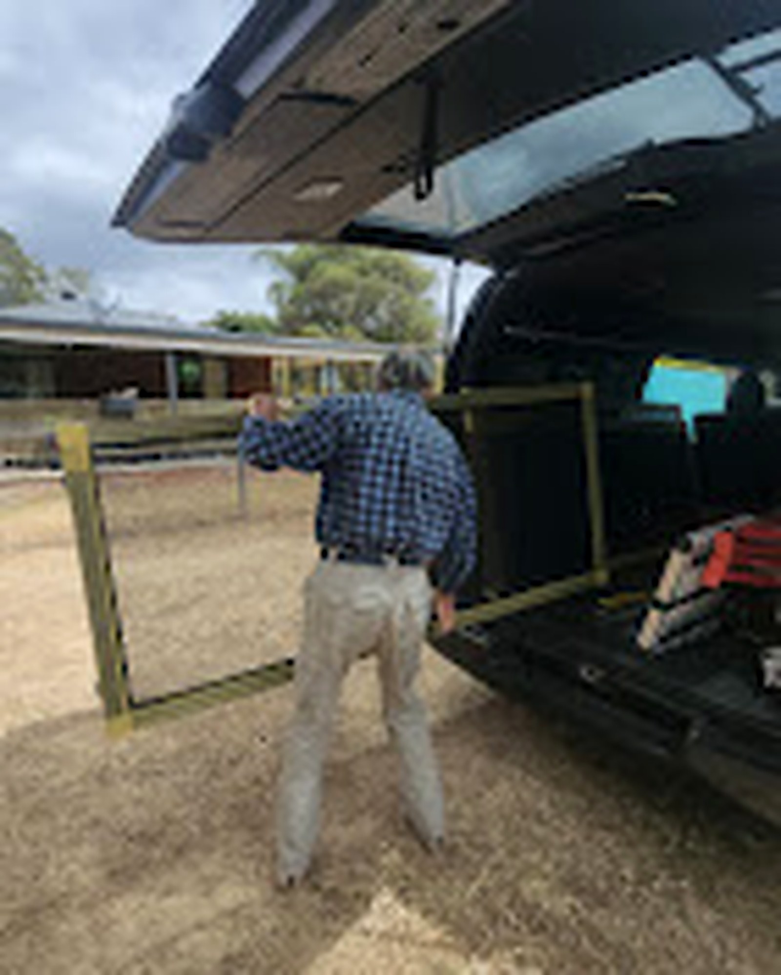 Team member loading a custom screen frame